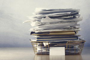 stack of paperwork including employer information