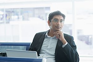 Indian citizen who is waiting for his flight at the airport in order to enter the United States on an EB-5 investor visa