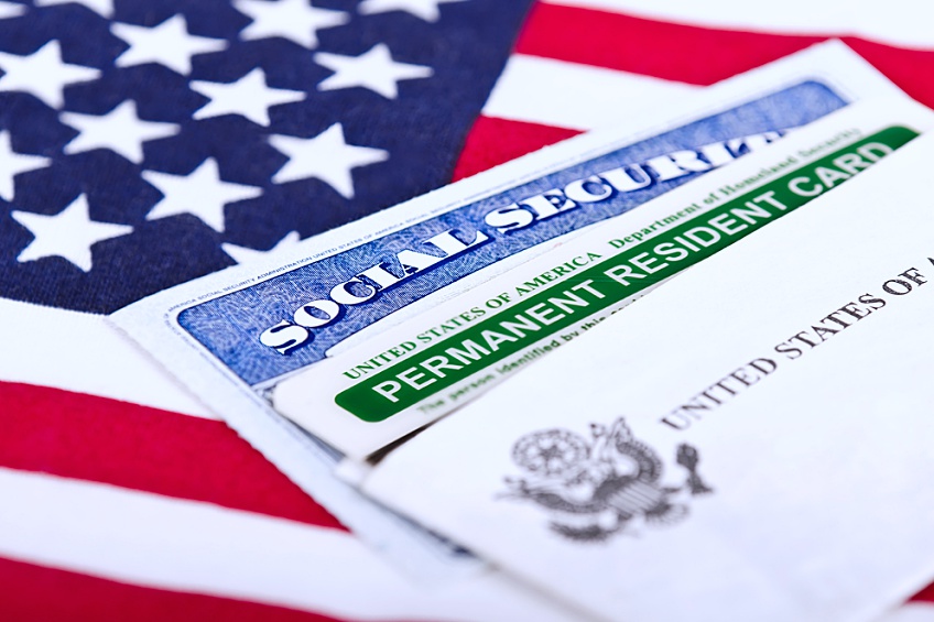 social security and permanent resident cards that an individual was granted after updating their EB-5 visa status so they could become a permanent resident of the United States