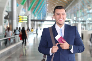 permanent labor certification recipient smiles while walking in the airport