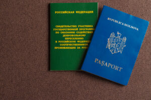the passports lay together as the tourist and fiance fill out the visa forms
