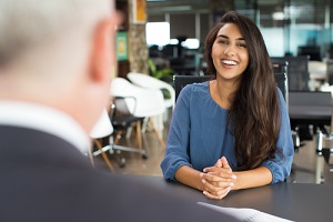 female candidate laughing at job interview