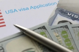 us visa application with dollars and pen