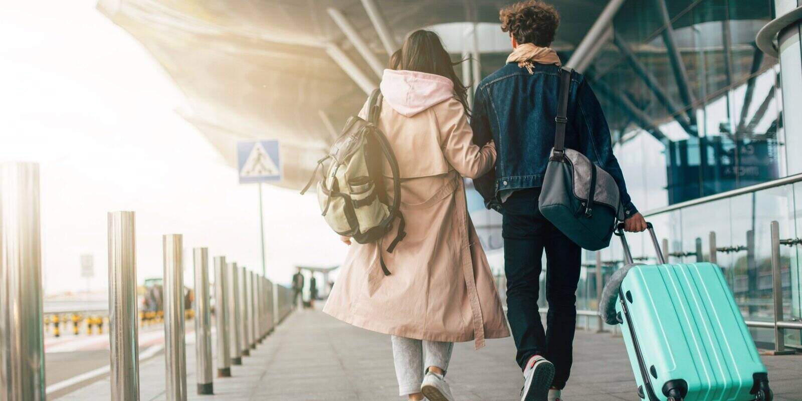 couple walking together out of airport