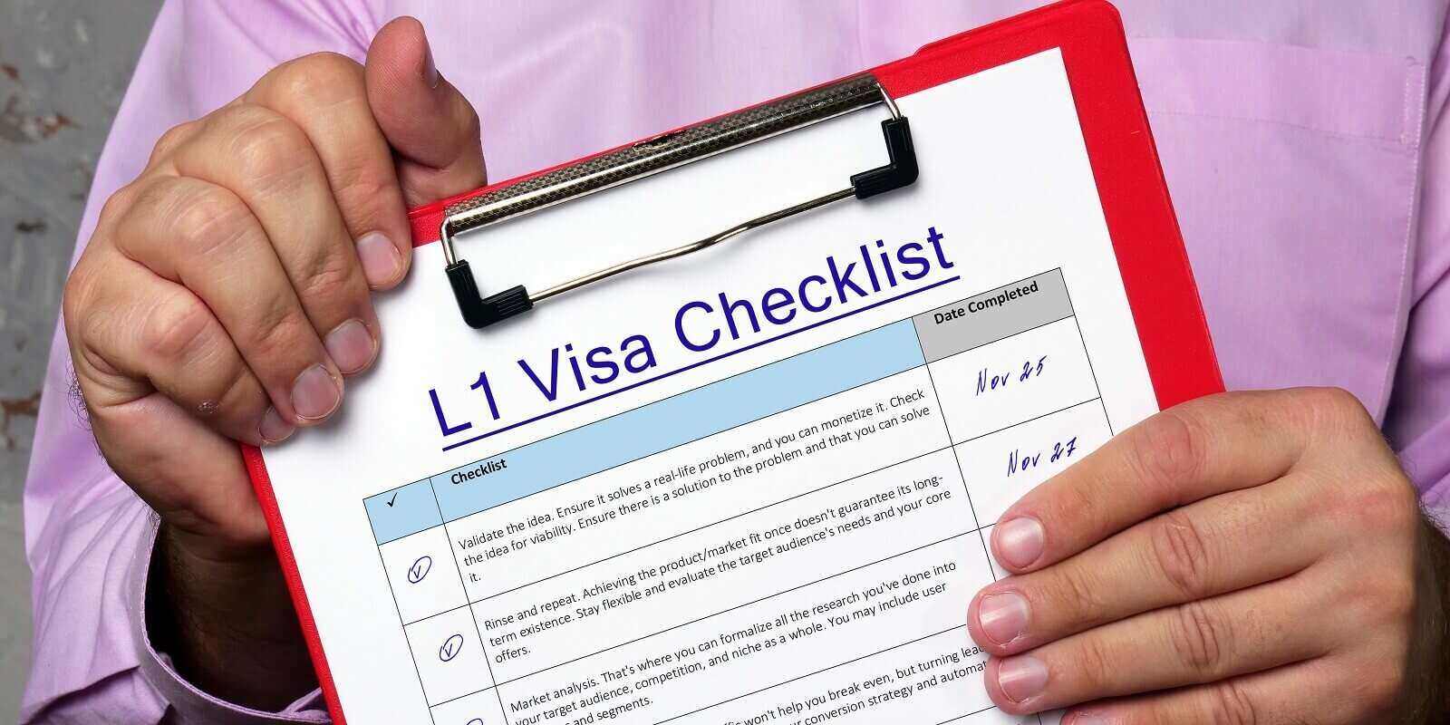 man with l1 visa checklist on red clipboard